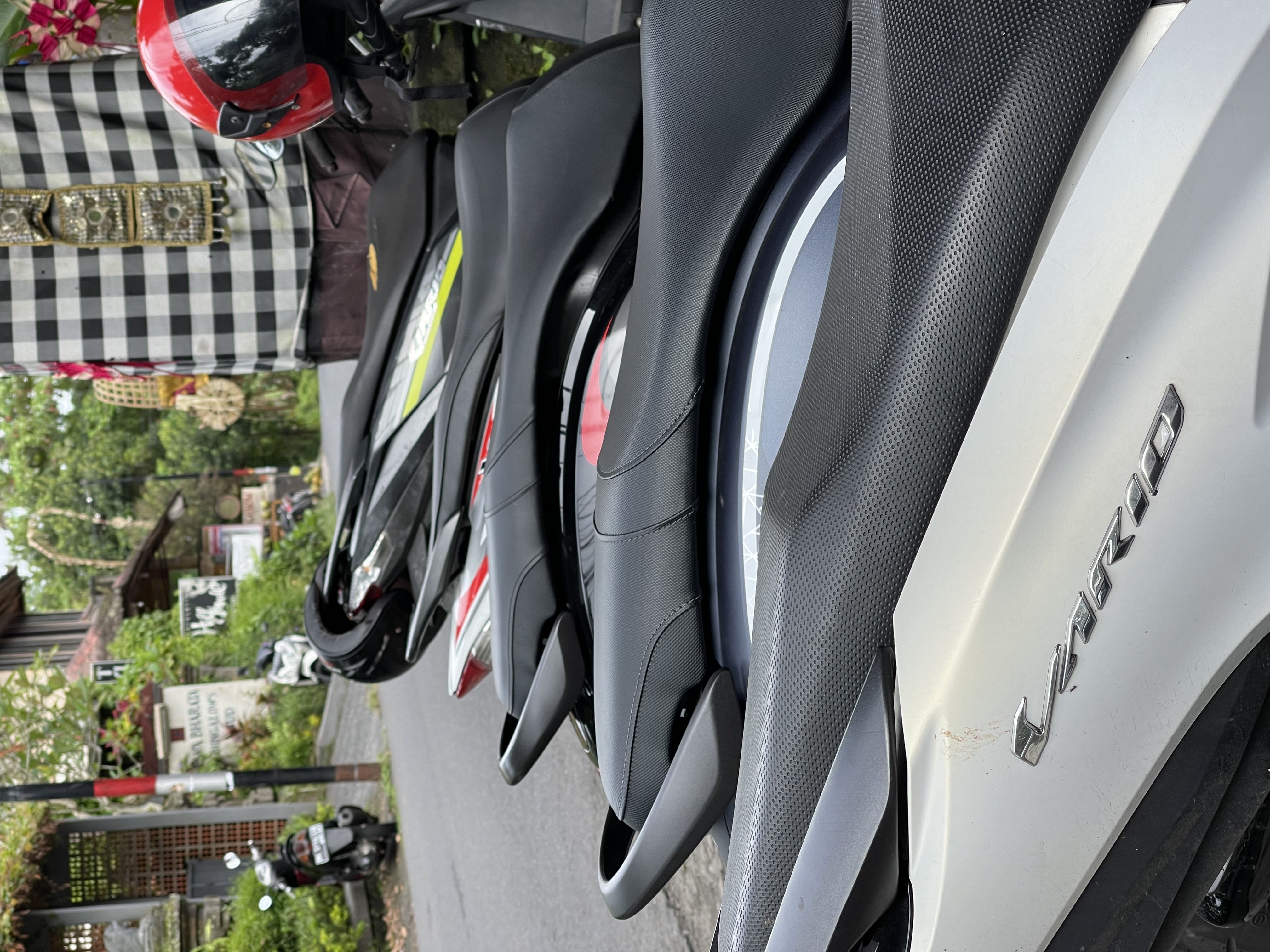 Scooters parked on a Penestanan lane, Ubud